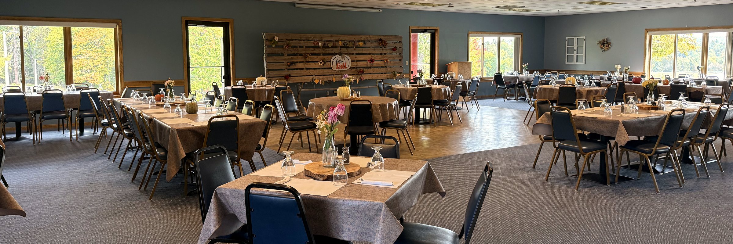 Oak Crest's banquet hall set with tables and linens for an event